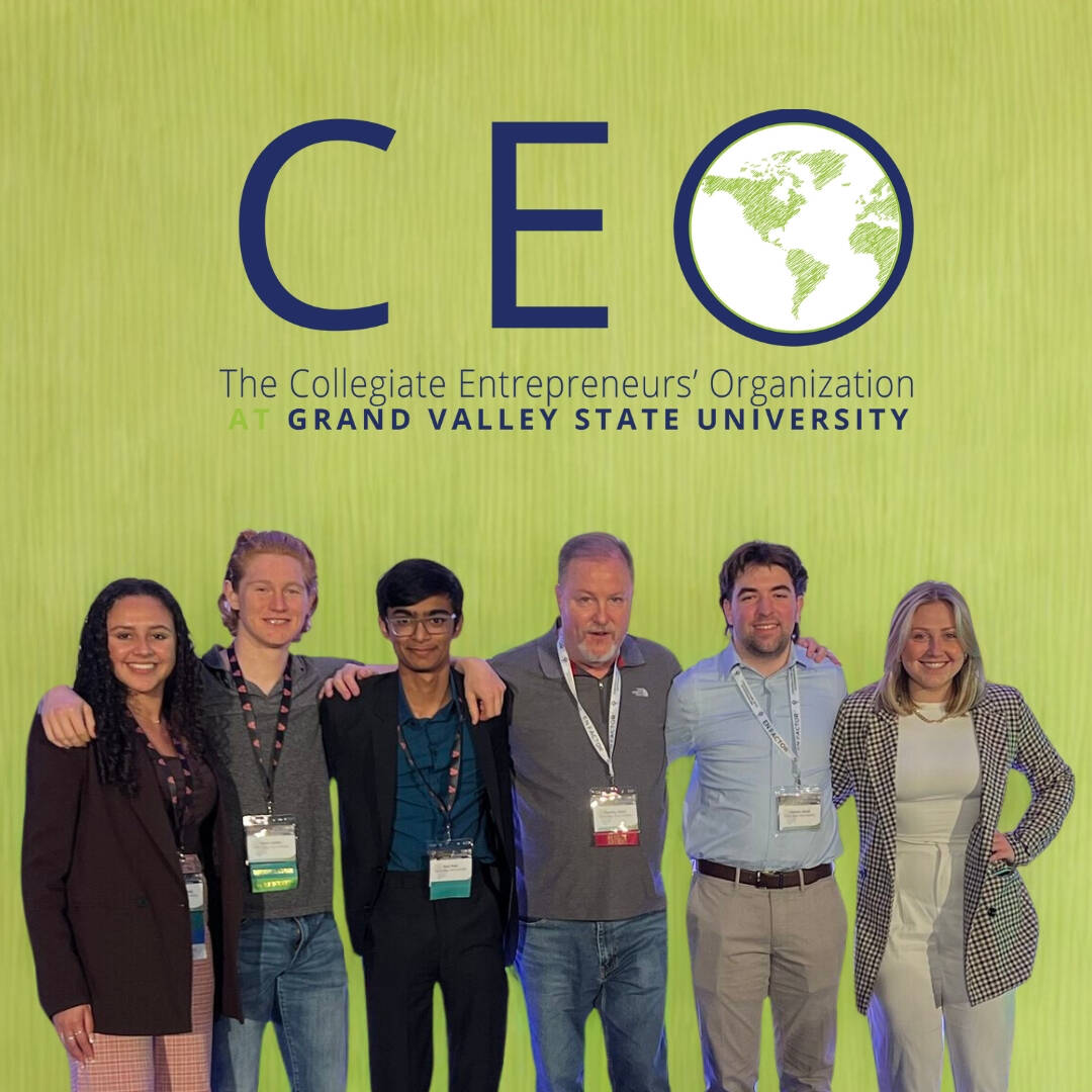 CEO Club Students with Faculty Advisory posing for photo with CEO Club Logo